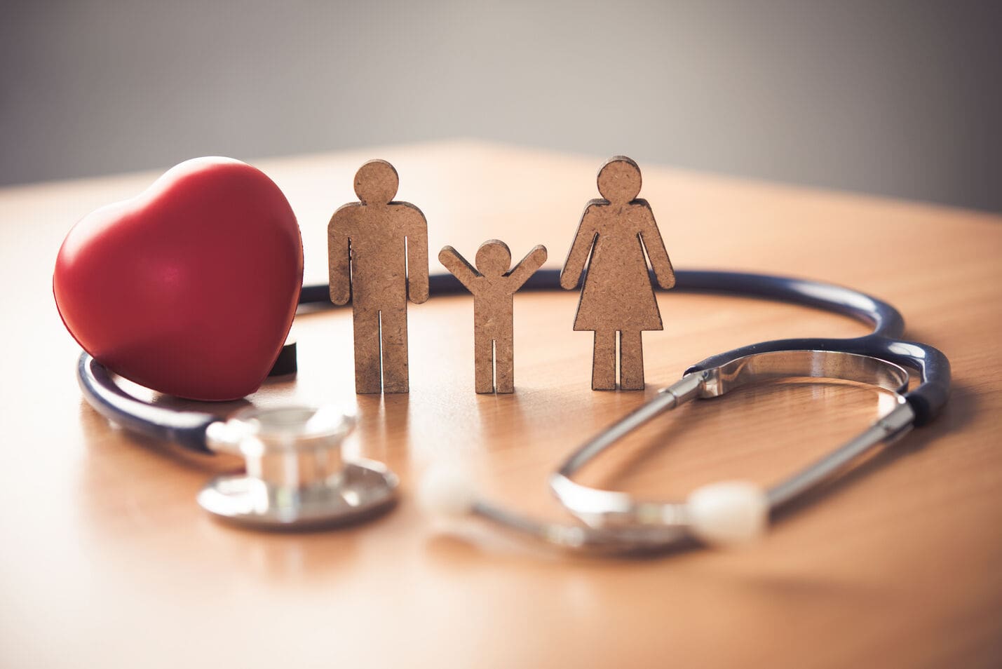 Family health insurance with a red heart.